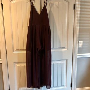 Short romper with shear flowing, open front skirt.